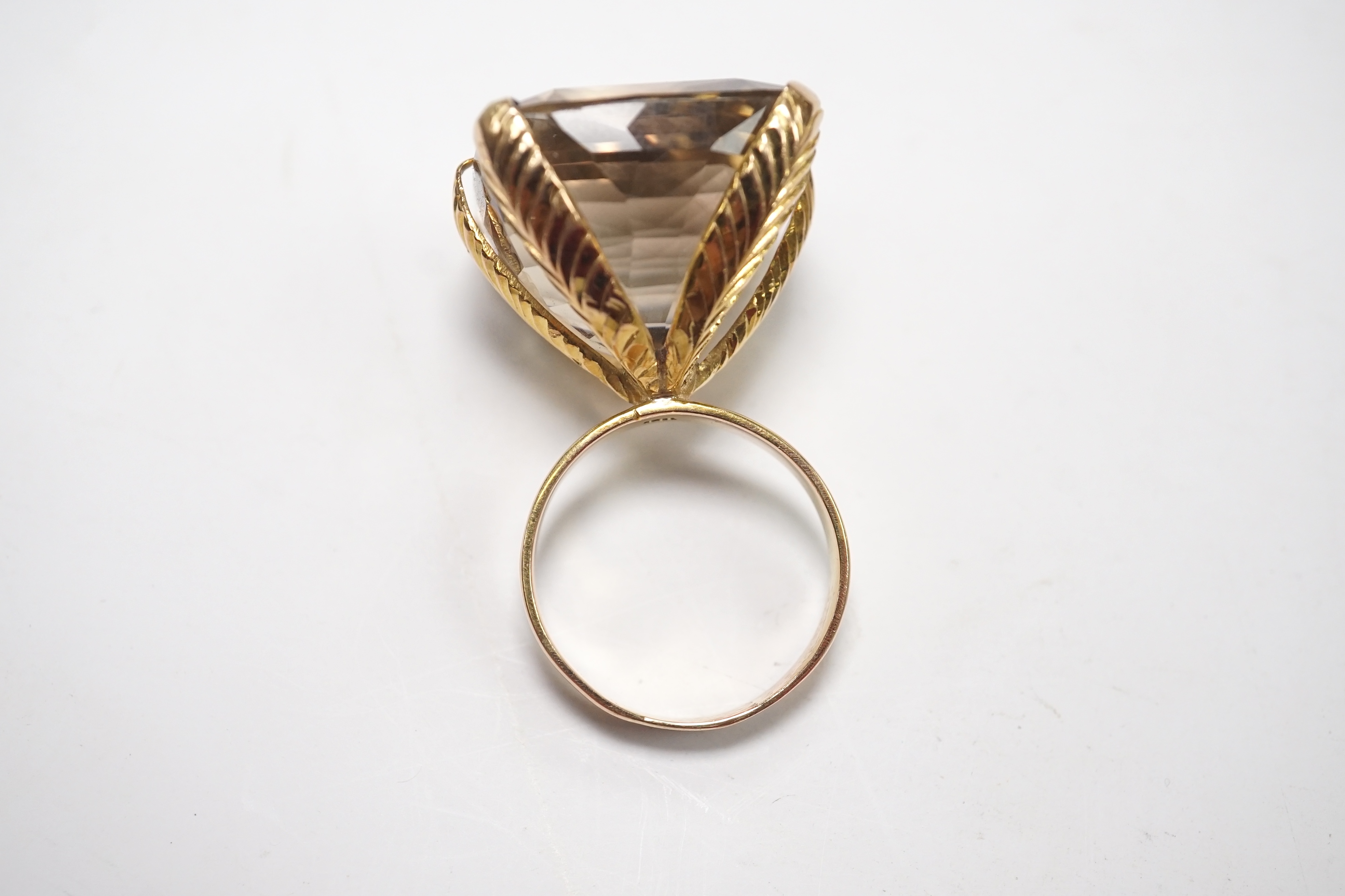 An 18k and large single stone smoky quartz set dress ring, size Q, gross weight 20.3 grams. Condition - fair to good